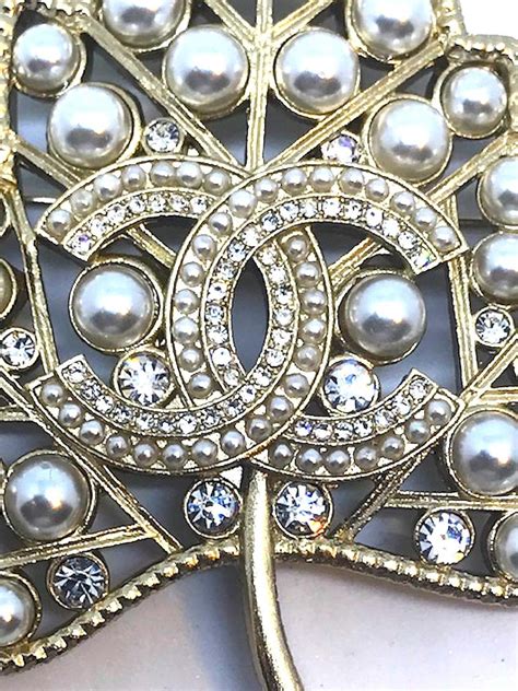 chanel pins 2018|Chanel brooch number 5.